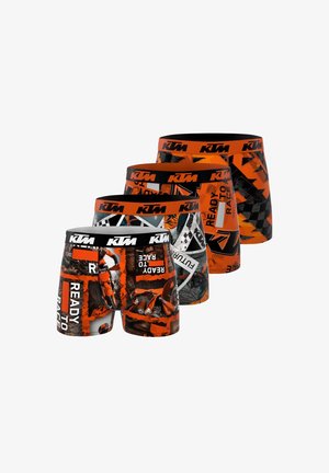 Quatre paires de boxers de la marque KTM présentent des motifs orange vif et des accents noirs avec des graphismes et des textes variés.