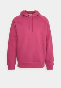 Hoodie in een felle roze kleur, gemaakt van een katoenmix. Beschikt over een voorste kangoeroezak en ribgebreide manchetten. Touwtje voor een verstelbare pasvorm.