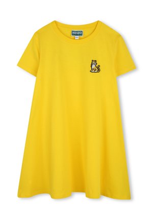 T-shirt jaune à manches courtes avec une coupe décontractée et un col rond. Présente un design de tigre brodé en noir et blanc sur la poitrine gauche.