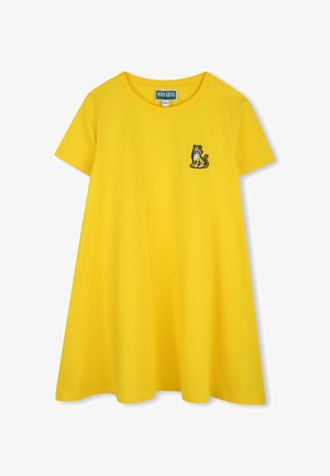 T-shirt jaune à manches courtes avec une coupe décontractée et un col rond. Présente un design de tigre brodé en noir et blanc sur la poitrine gauche.