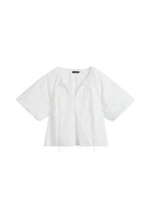 Witte losse blouse met korte mouwen, V-hals en koordjes bij de halslijn, gemaakt van lichtgewicht stof.