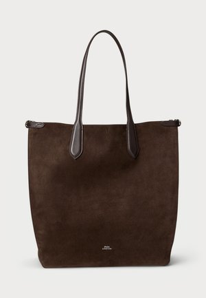 Brown suede tote bag with dark leather accents, two long handles, and a minimalist design. Features visible brand logo on the front.