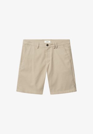 Beige shorts made of lightweight fabric with a smooth texture. Features front pockets and a single button closure at the waist.