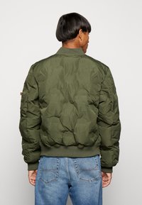 Alpha Industries MA-1 LOGO PUFFER - Pilotska jakna - dark olive