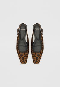 Leopard print slingback shoes made of textile, featuring a square toe and a metal buckle. The interior is black with a smooth texture.