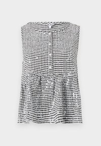 Zwart-wit geruit mouwloos topje met een knoopsluiting aan de voorkant en een peplum zoom, voorzien van glanzende pailletten in de stof verwerkt.
