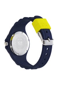 Marineblaue Silikon-Uhr mit einem leuchtend gelben Akzent und einem Gehäuseboden aus Edelstahl. Verfügt über ein abgerundetes Design und ein verstellbares Armband.