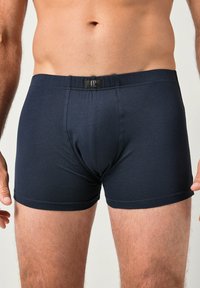 Marina blå tygboxershorts med en åtsittande passform, elastisk midjeband med en logotagg, slät yta och fållade benslut.