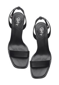 Svarta sandaler med öppen tå och minimalistisk design, med två breda remmar och en slank vristrem. Tillverkade av mjukt läder med en texturerad innersula.