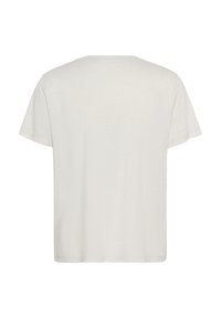 Tricou alb cu mânecă scurtă, având guler rotund și un design simplu, neîmpodobit. Textură moale, cu o croială lejeră.