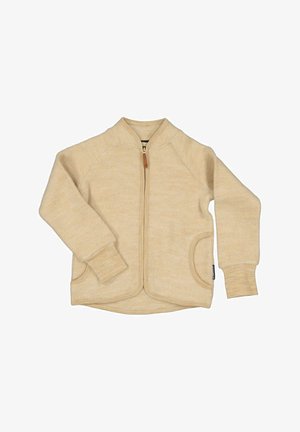 Beige fleecejakke med en lynlås foran, raglanærmer, sidelommer og ribstrikkede manchetter. Blød tekstur med et varmt, afslappet design.