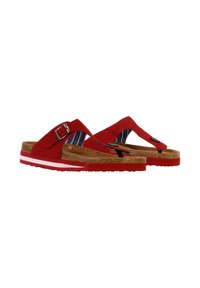 Red flip-flops with a suede upper, cork insole, and a narrow strap featuring a silver buckle. White and red rubber sole with textured tread.