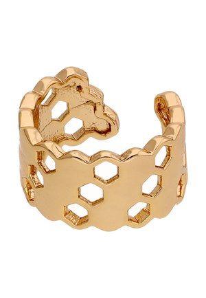 Gouden open ring met zeshoekige uitsnijdingen en geschulpte randen, met een geometrisch ontwerp geïnspireerd op honingraat.