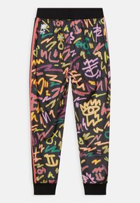 Färgglada joggers i svart tyg, med livliga, abstrakta mönster i rosa, gult, grönt och blått. Utrustade med resårmidja.