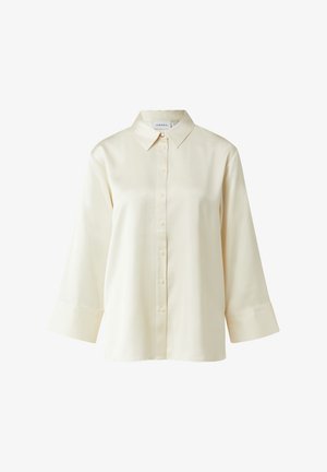 Koszula w kolorze kremowym, z długim rękawem i zapięciem na guziki, wykonana z gładkiej tkaniny, z klasycznym kołnierzykiem i lekko rozszerzanymi mankietami.