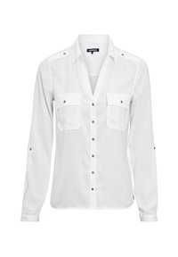 Camicia bianca a maniche lunghe con abbottonatura frontale, due taschini sul petto e dettagli in bottoni bronzo. Tessuto liscio e design del colletto classico.