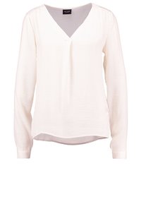 Blusa bianca a maniche lunghe con scollatura a V, dotata di un leggero dettaglio a pieghe sotto il colletto e un sottile orlo asimmetrico.