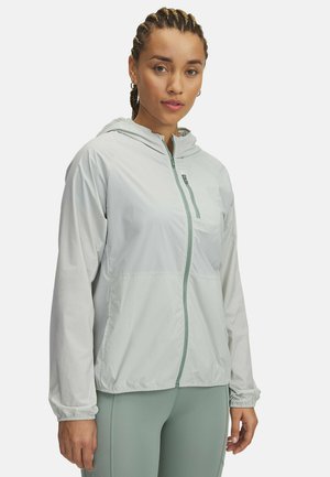 Lightweight, hooded jacket in light grey, featuring a front zipper and pocket. Smooth fabric with elastic cuffs and cinched hem for fit.