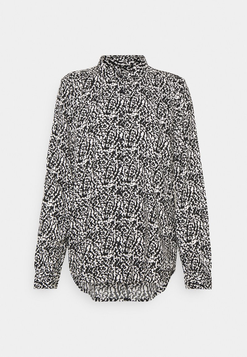 Long-sleeve button-up shirt featuring a black and white abstract pattern, a collar, and a rounded hem. Made of lightweight fabric.