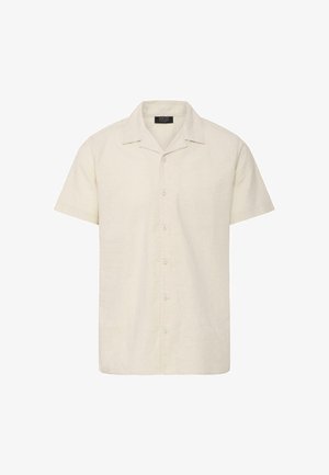 Chemise beige à manches courtes avec col ouvert et boutons sur le devant, confectionnée en tissu léger.
