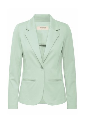 Világoszöld blézer sima anyagból, klasszikus szakáccsal, egysoros gombos zárással és két elülső zsebbel. Testre szabott szabás.