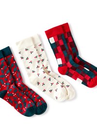 Cztery pary skarpet: czerwone z wzorem ostrokrzewu, kremowe z nadrukiem jagód, w kratę w kolorach czerwonym i granatowym oraz jednolite czerwone z prążkowanym czerwonym mankietem.