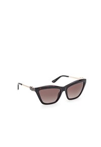 Gafas de sol de estilo cat-eye con un patrón de carey, lentes gradientes marrones y detalles metálicos en los laterales. Hechas de plástico y metal.