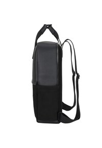 Black backpack featuring a smooth leather top, fabric bottom, side pocket, and adjustable straps. Compact shape with a zippered closure.