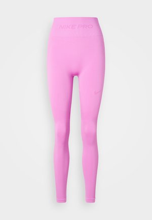 High-waisted, seamless pink Nike Pro leggings with subtle logo on waistband and left thigh, designed for athletic wear.
