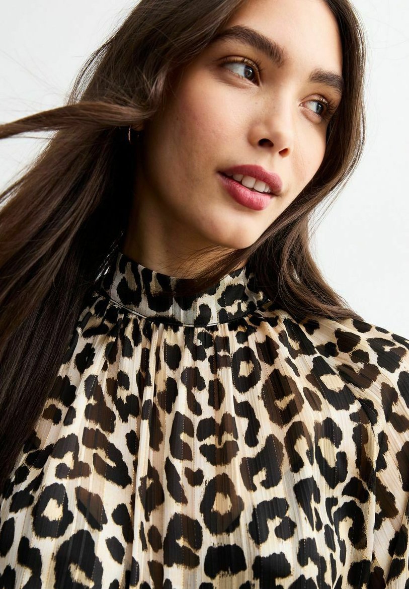 animal print high neck blouse