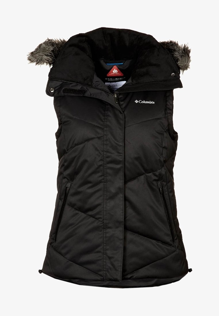 Veste sans manches Columbia noire isolée avec fermeture éclair à l'avant, deux poches zippées, et capuche détachable avec bordure en fausse fourrure.