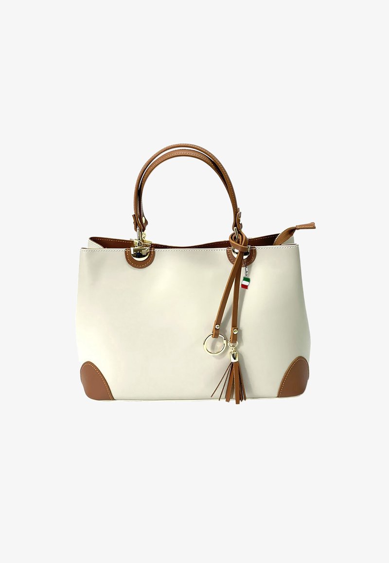 Beige tote bag met bruine accenten, handvatten bovenop en een afneembare franjer. Gemaakt van glad materiaal met ronde hoeken en gouden details.