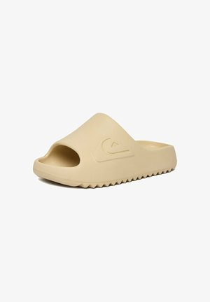 Beige instap-sandaal met open teen, getextureerde zool en een reliëf golf-logo aan de zijkant, ontworpen voor casual gebruik.