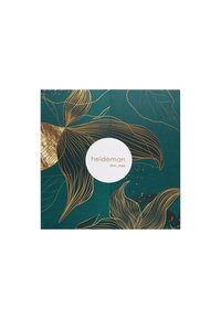 Green packaging featuring gold line art of flowers and leaves, with a circular white logo in the center, minimalist and elegant design.