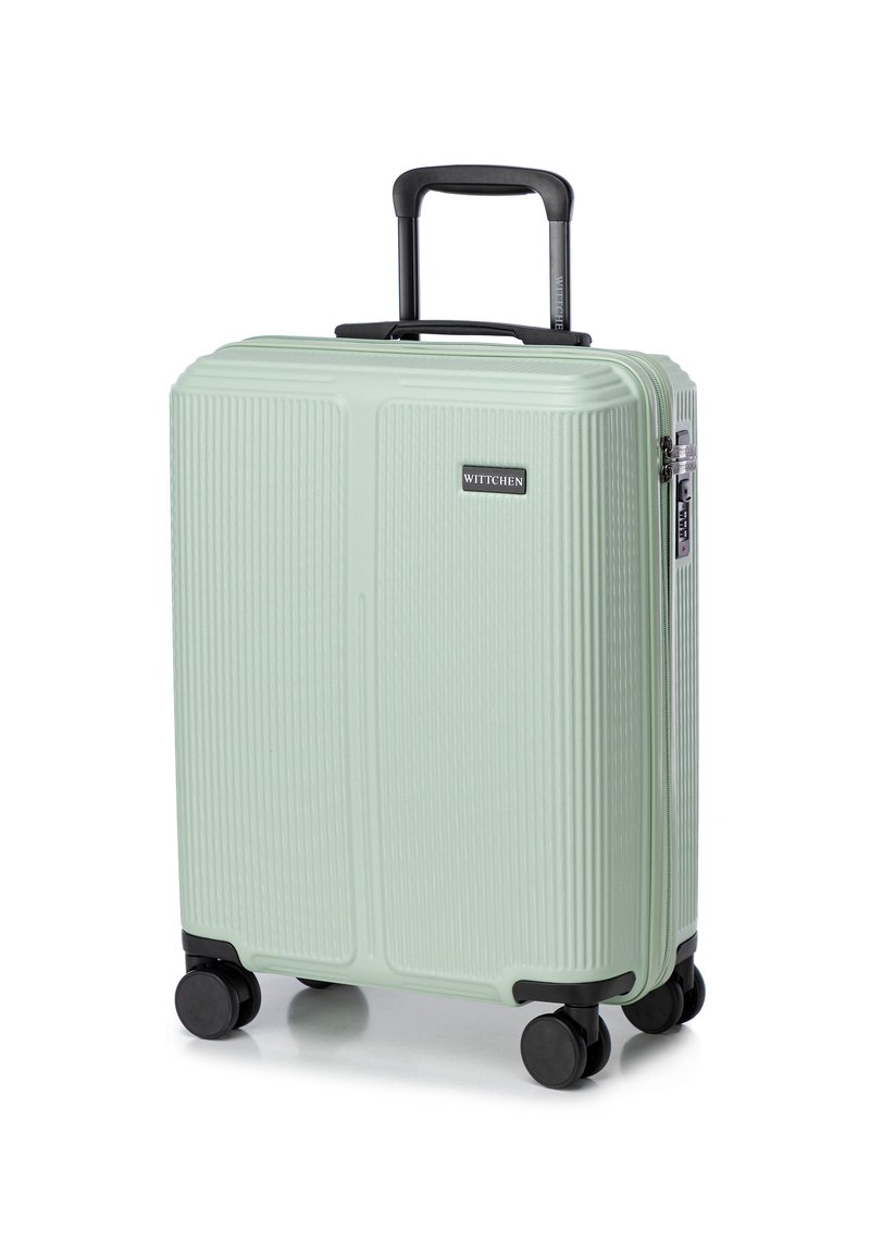Hard-sided mint green suitcase with vertical ribbed texture, retractable handle, and four black wheels for mobility. Features a logo patch.