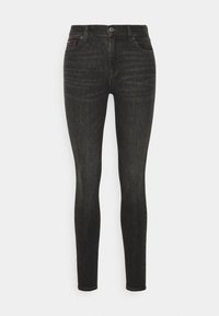 Smala jeans i mörk tvättad denim. Har en midjehöjd, fem fickor och subtila blekningsdetaljer. Silverfärgade detaljer på knappen och nitarna.