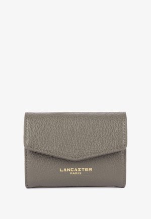 Grey leather wallet with a textured surface, a triangular flap, and gold embossed branding. Compact design suitable for essentials.