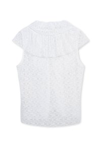 Blouse en dentelle blanche avec un col à volants et des manches courtes. Texture transparente avec un motif floral, design élégant et léger.