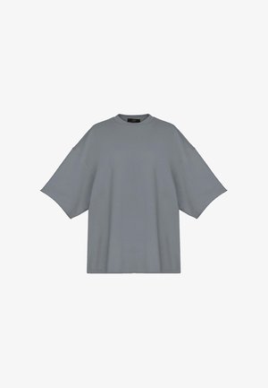 Szary, oversize'owy t-shirt wykonany z miękkiego materiału, z okrągłym dekoltem i krótkimi, opuszczonymi rękawami. Brak widocznych wzorów lub ozdób.