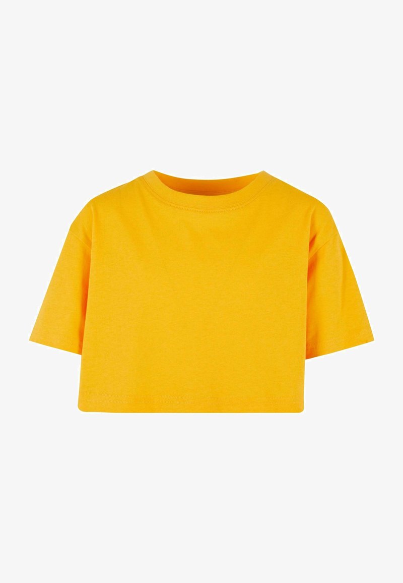 Dzeltena īsa T-kreklu izgatavota no kokvilnas, ar īsām piedurknēm, apaļu kakla izgriezumu un gludu tekstūru. Nav rakstu vai grafikas.