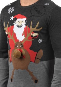Knit sweater featuring Santa riding a reindeer, grey and black color scheme, with a textured pom-pom nose and festive snowflake patterns.