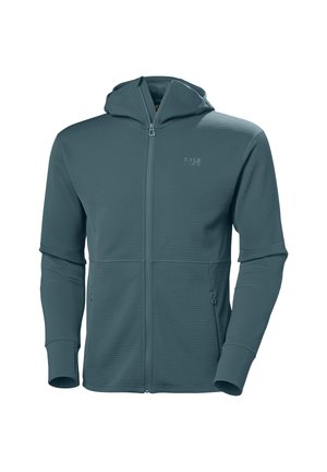 Capuchon met ritssluiting in donker turkoois. Gemaakt van textiel met een textuur, voorzien van twee voorzakken en aansluitende manchetten. Subtiel logo nabij de rits.