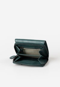 Green leather wallet with a zip closure, multiple card slots, and an interior coin pocket, featuring a smooth texture and contrasting lining.