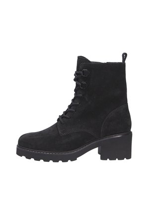 Bottine en suede noire avec un talon épais, un laçage à l'avant, une languette à l'arrière et une semelle robuste pour une utilisation en extérieur.