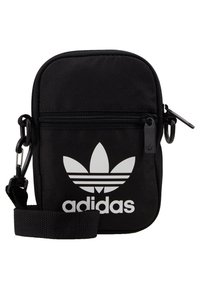Czarna torba na ramię Adidas z białym logo trefoil, z przednią kieszenią na zamek i regulowanym paskiem z plastikowym klipsem.