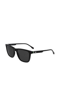 Ochelari de soare negri cu lentile pătrate, accent verde pe bratul negru și detalii cu logo argintiu. Prezintă lentile gri închis și un design elegant.