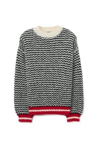 Suéter de punto con un patrón de zigzag en blanco y negro, cuello crema y borde inferior y puños acanalados en rojo. Textura suave, ajuste holgado.