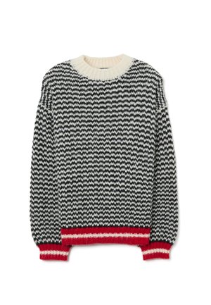 Suéter de punto con un patrón de zigzag en blanco y negro, cuello crema y borde inferior y puños acanalados en rojo. Textura suave, ajuste holgado.