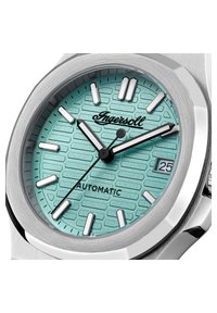 Silver automatic watch with a textured, mint green dial, white hour markers, and a date display at 3 o'clock. Polished stainless steel case.