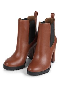 Brown leather ankle boots with a glossy finish, elastic black side panels, and a chunky black heel. Textured rubber sole with traction.